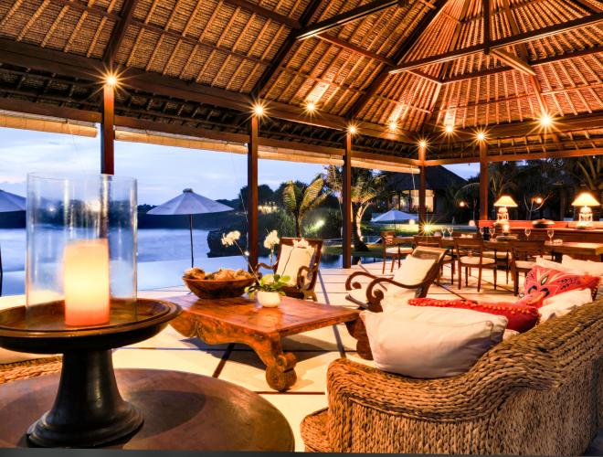 LARGE OPEN LIVING & DINING AREA BORDERED BY THE AMAZING INFINITY POOL AND SUNDECK